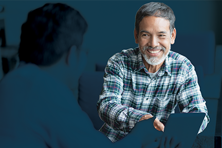 Middle aged safety professional man talking to younger safety professional man about psychological safety in the workplace